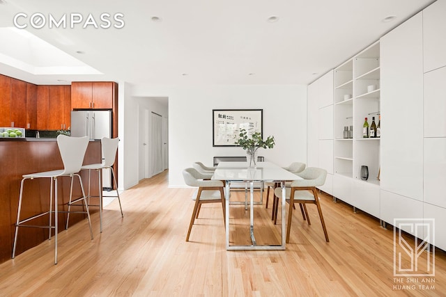 222 23rd St Unit C, New York City, NY 11232 - dining space featuring light wood-type flooring and built in shelves