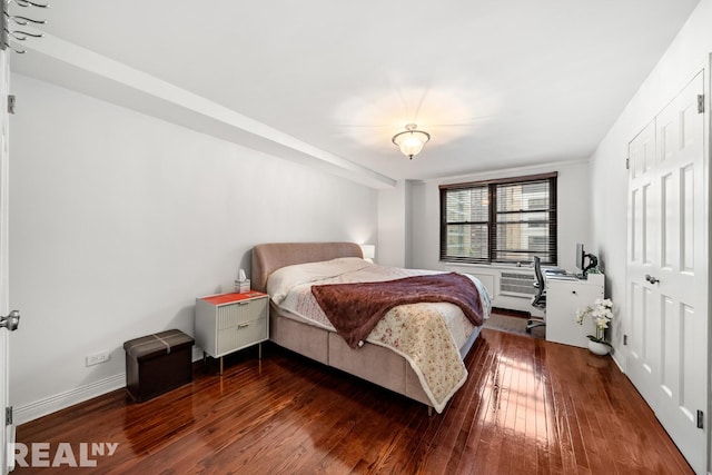 235 E 57th St Unit 14C, New York City, NY 10022 - bedroom featuring wood finished floors, baseboards, and a closet