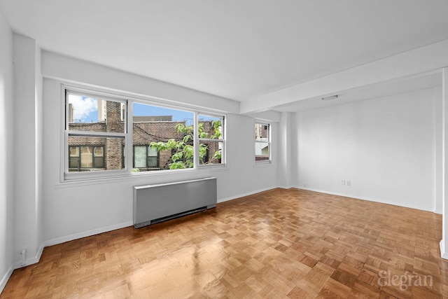 445 E 86th St Unit 6G, New York City, NY 10028 - spare room featuring radiator heating unit and baseboards
