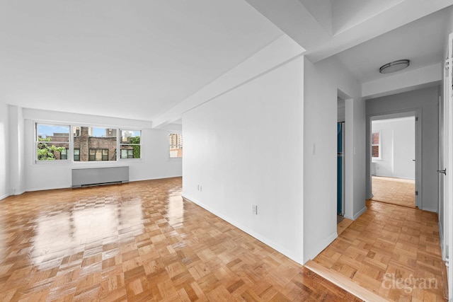 445 E 86th St Unit 6G, New York City, NY 10028 - unfurnished living room with radiator and baseboards