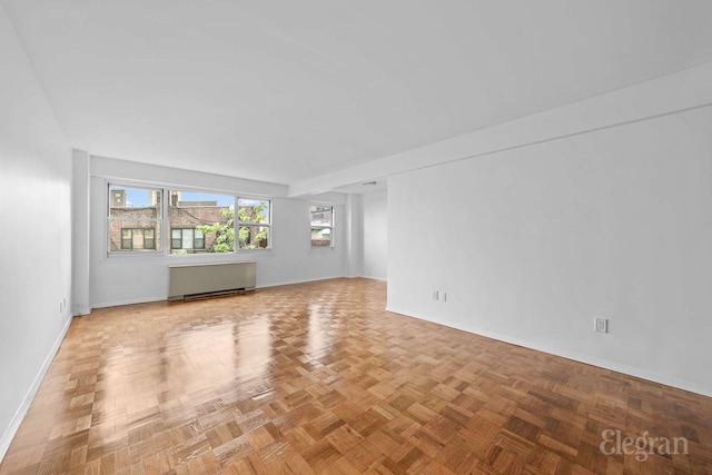 445 E 86th St Unit 6G, New York City, NY 10028 - spare room featuring radiator and baseboards