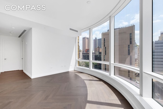 111 Murray St Unit 11C, New York City, NY 10007 - unfurnished room with a view of city and baseboards