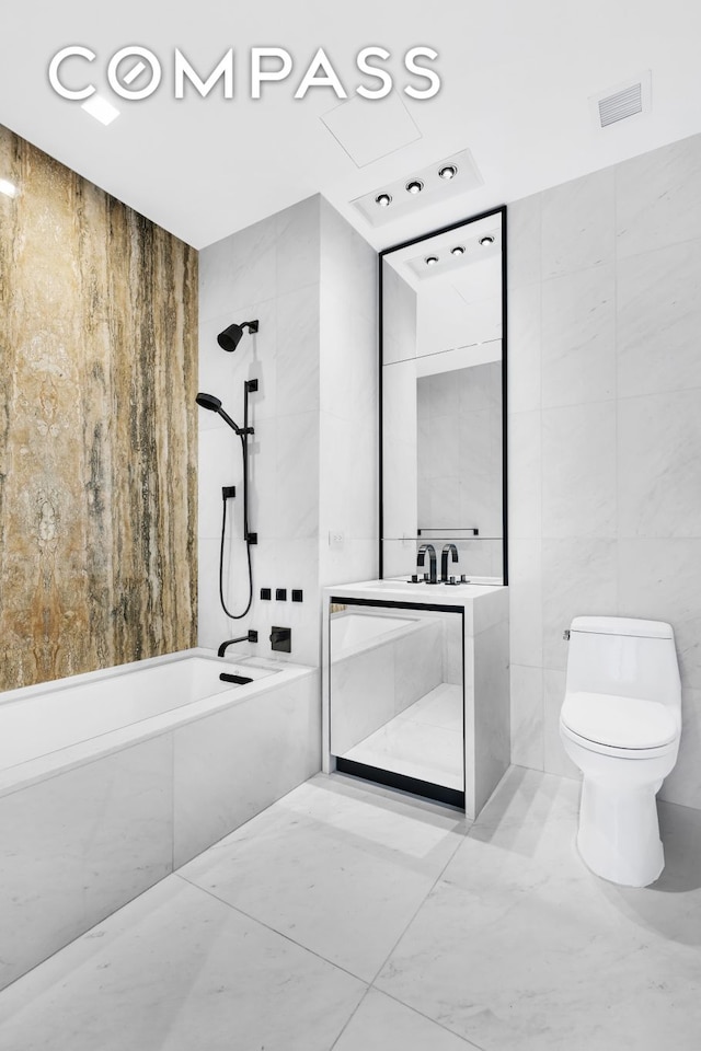 111 Murray St Unit 11C, New York City, NY 10007 - full bathroom with tile walls, tub / shower combination, toilet, and vanity