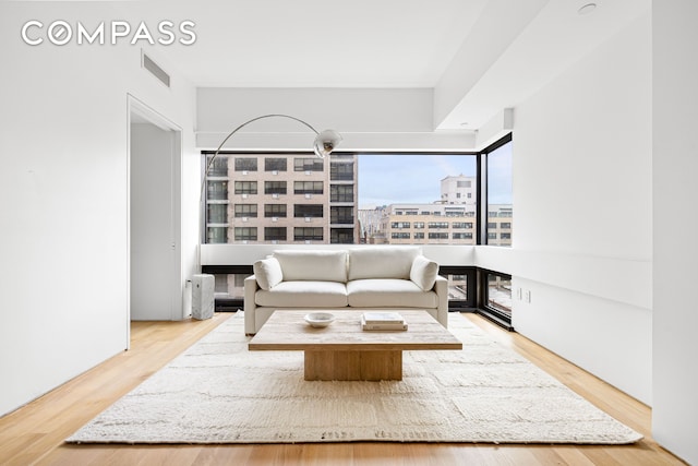 123 3rd Ave Unit 9C, New York City, NY 10003 - living room with a view of city and wood finished floors
