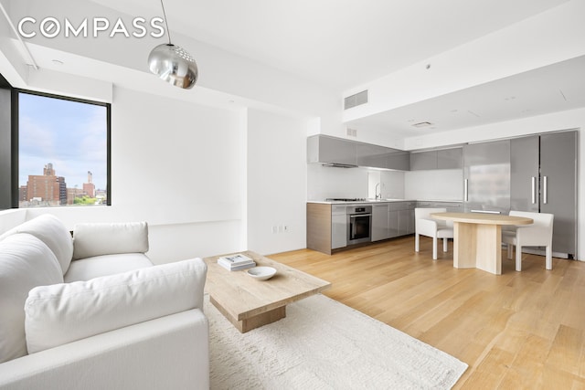 123 3rd Ave Unit 9C, New York City, NY 10003 - living area with light wood-style floors
