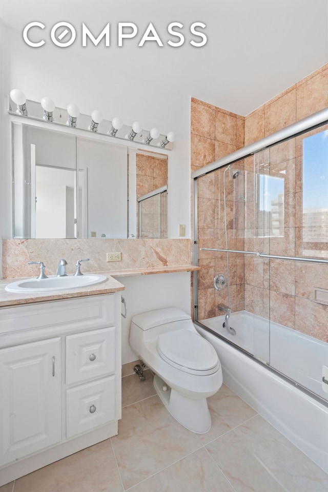 171 E 84th St Unit 31C, New York City, NY 10028 - full bathroom with toilet, vanity, enclosed tub / shower combo, and tile patterned flooring