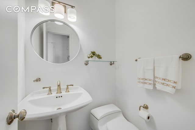 171 E 84th St Unit 31C, New York City, NY 10028 - bathroom featuring toilet and a sink
