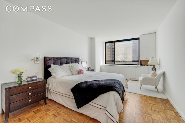 171 E 84th St Unit 31C, New York City, NY 10028 - bedroom featuring baseboards