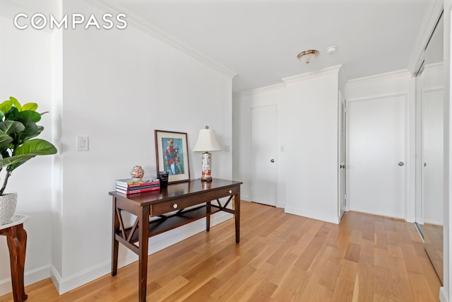 171 E 84th St Unit 31C, New York City, NY 10028 - hallway with light wood finished floors, ornamental molding, and baseboards