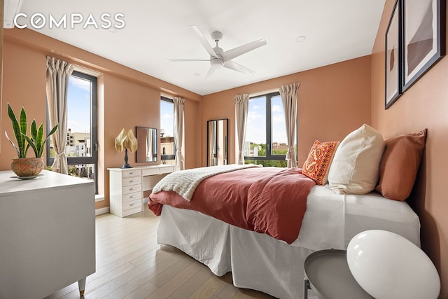 511 Evergreen Ave Unit 3D, New York City, NY 11221 - bedroom with light wood-style flooring and a ceiling fan