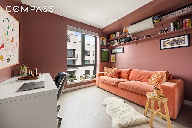 511 Evergreen Ave Unit 3D, New York City, NY 11221 - office area featuring a wall mounted air conditioner and light wood-style flooring