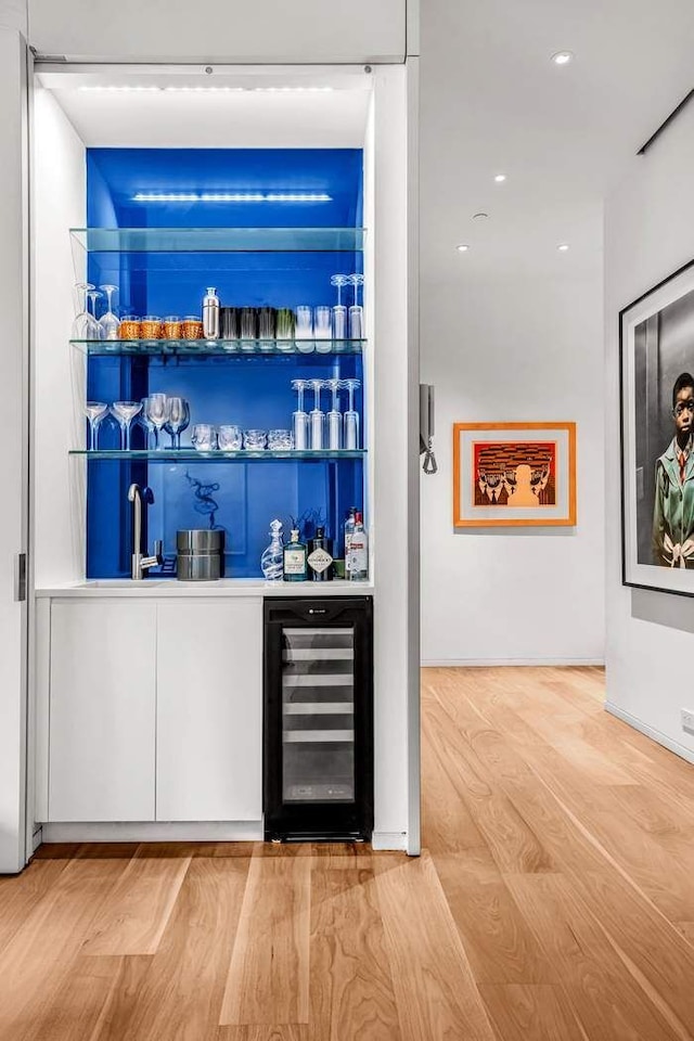 30 E 21st St Unit 3B, New York City, NY 10010 - indoor wet bar featuring wine cooler, wood finished floors, and recessed lighting