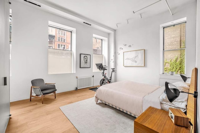 30 E 21st St Unit 3B, New York City, NY 10010 - bedroom featuring radiator and light wood-style floors