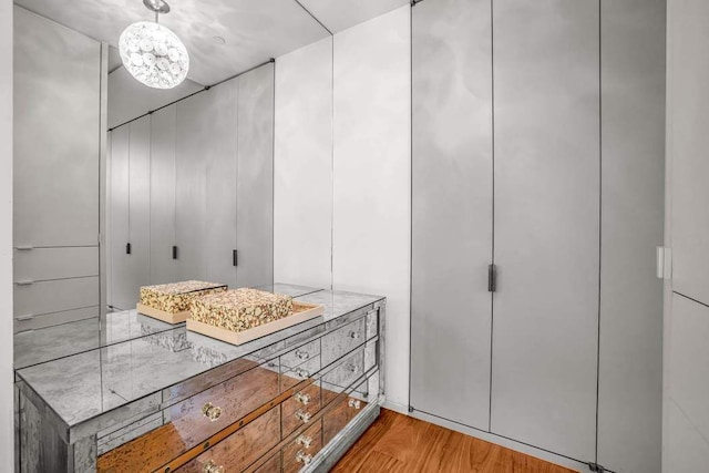 30 E 21st St Unit 3B, New York City, NY 10010 - bathroom with wood finished floors and a chandelier