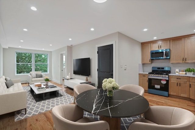 60-14 Menahan St, New York City, NY 11385 - living room with light wood-style floors and recessed lighting