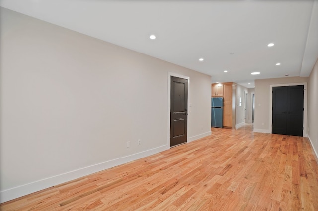 60-14 Menahan St, New York City, NY 11385 - unfurnished living room featuring recessed lighting and light wood finished floors