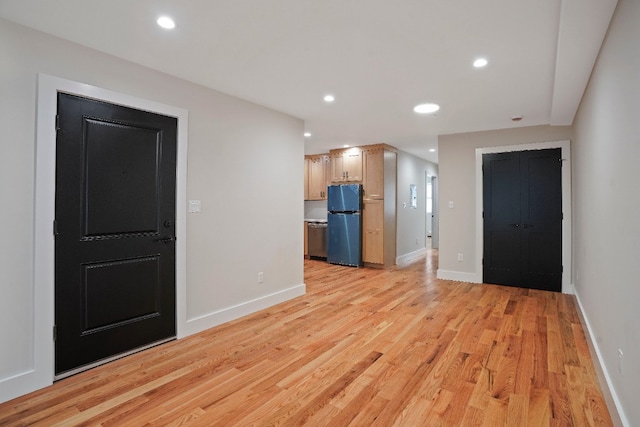 60-14 Menahan St, New York City, NY 11385 - unfurnished living room featuring light wood-style flooring and recessed lighting