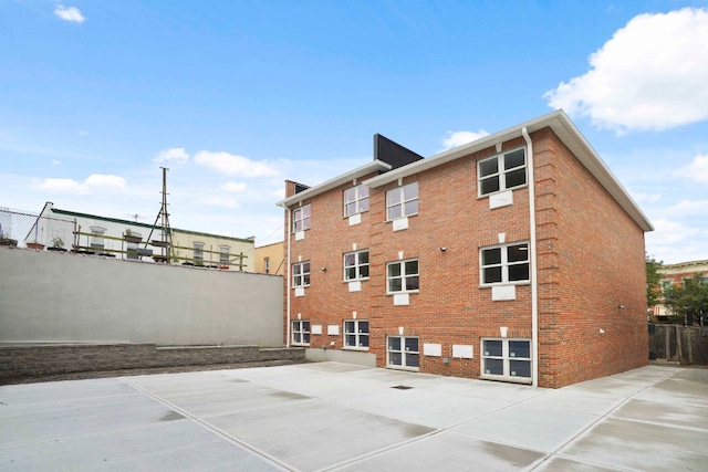 60-14 Menahan St, New York City, NY 11385 - view of property exterior featuring brick siding