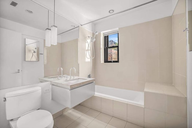 124 Hudson St Unit 6D, New York City, NY 10013 - bathroom with toilet, tiled shower / bath, vanity, and tile patterned floors