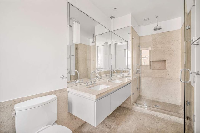 124 Hudson St Unit 6D, New York City, NY 10013 - bathroom featuring toilet, a stall shower, and double vanity