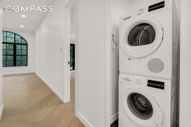90 Herbert St Unit 3A, New York City, NY 11222 - laundry area with stacked washing machine and dryer, baseboards, recessed lighting, and parquet floors