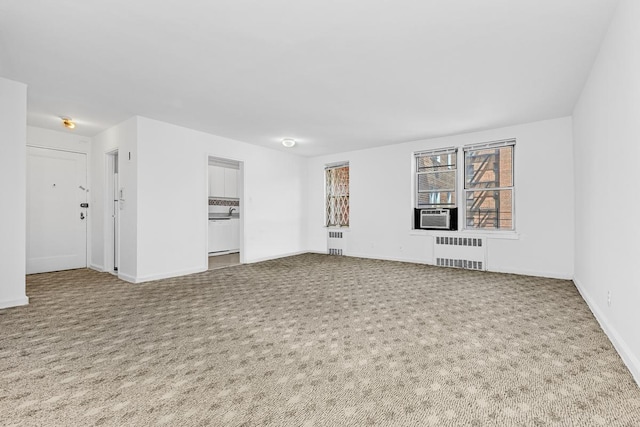 105-34 65th Ave Unit 4G, New York City, NY 11375 - unfurnished living room with radiator heating unit, carpet, and baseboards