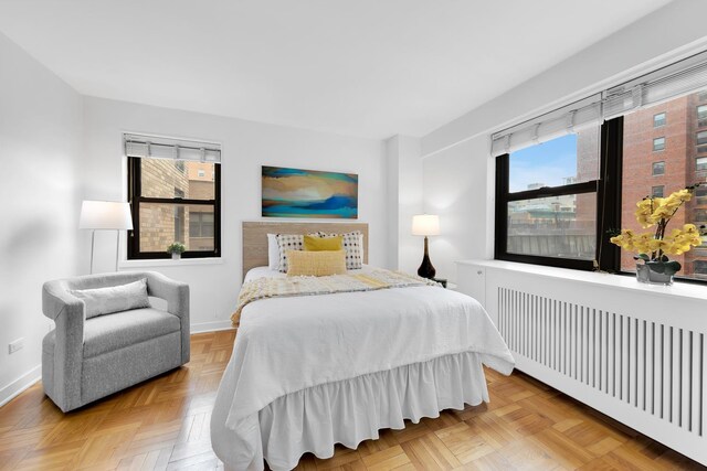 305 E 72nd St Unit 6Is, New York City, NY 10021 - bedroom featuring radiator and baseboards