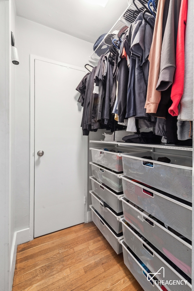 229 E 28th St Unit 4K, New York City, NY 10016 - walk in closet featuring light wood finished floors