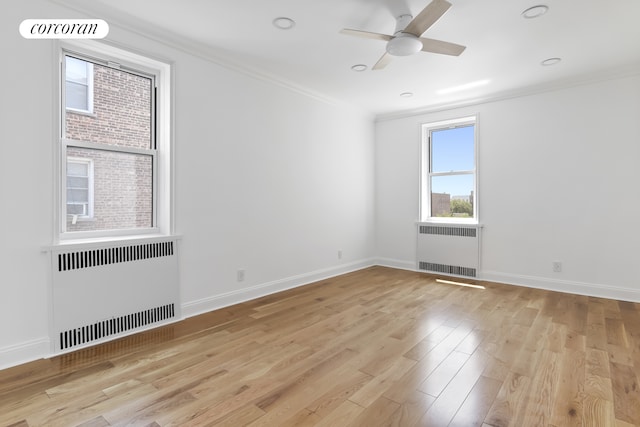 140 E 2nd St Unit 5D, New York City, NY 11218 - unfurnished room featuring radiator, crown molding, light wood-style flooring, and ceiling fan