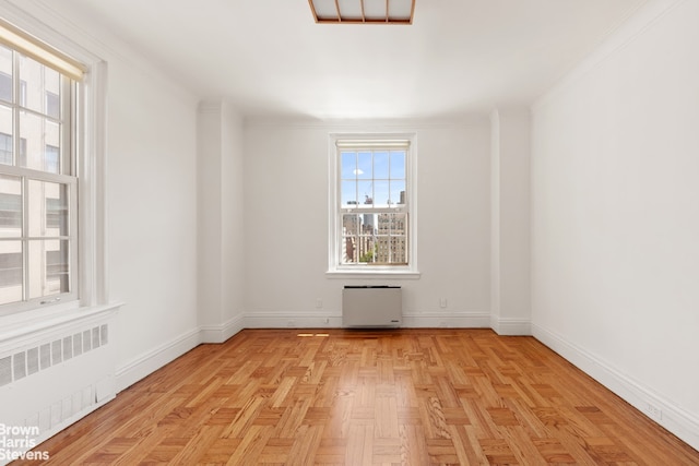 956 5th Ave Unit 11Thfloor, New York City, NY 10075 - empty room featuring radiator, ornamental molding, and baseboards