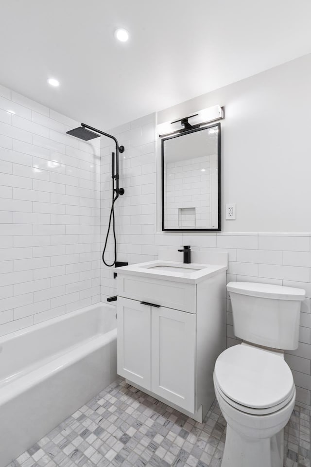 142 W End Ave Unit 2U, New York City, NY 10023 - full bath featuring vanity, toilet, tile walls, washtub / shower combination, and recessed lighting