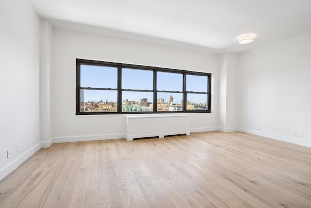 180 W End Ave Unit 30R, New York City, NY 10023 - unfurnished room with wood finished floors and radiator heating unit