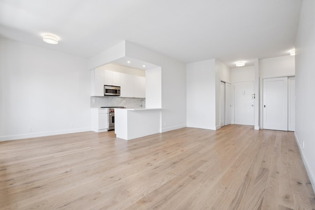 180 W End Ave Unit 30R, New York City, NY 10023 - unfurnished living room with light wood-type flooring and recessed lighting