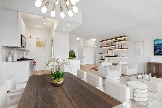 180 W End Ave Unit 30R, New York City, NY 10023 - dining room with a chandelier and light wood-type flooring