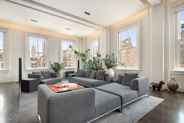 43 W 13th St Unit 7R, New York City, NY 10011 - living room with dark wood-type flooring and brick wall