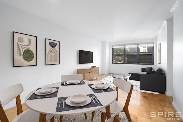 245 E 25th St Unit 6L, New York City, NY 10010 - dining room featuring baseboards