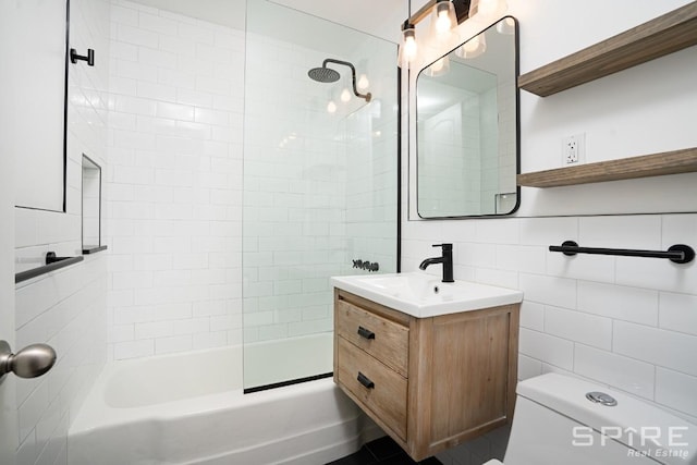 245 E 25th St Unit 6L, New York City, NY 10010 - bathroom featuring vanity, bathtub / shower combination, and tile walls