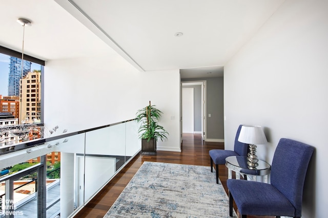 99 Warren St Unit 11C, New York City, NY 10007 - living area featuring dark wood-style floors, plenty of natural light, and baseboards
