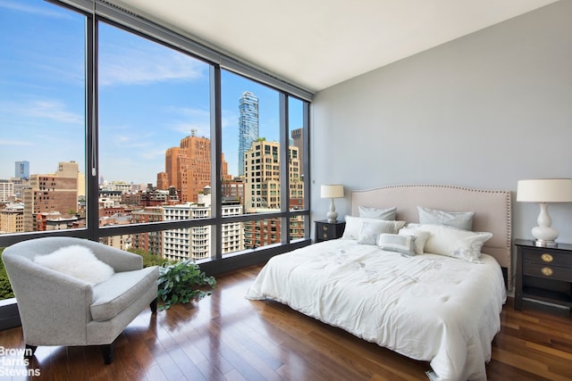 99 Warren St Unit 11C, New York City, NY 10007 - bedroom with a city view, floor to ceiling windows, multiple windows, and wood finished floors