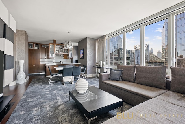 60 Riverside Blvd Unit 2403, New York City, NY 10069 - living area with dark wood-type flooring, a city view, and baseboards