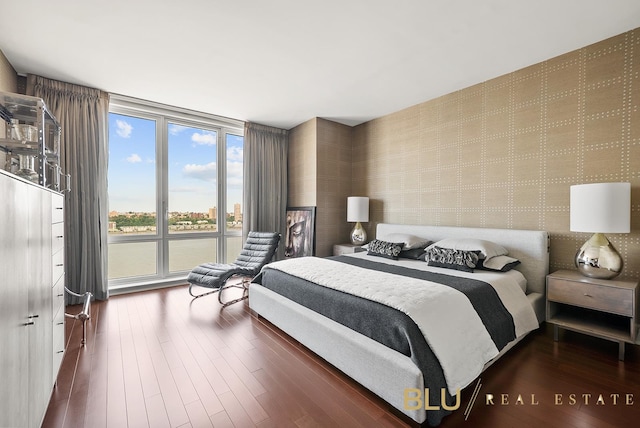 60 Riverside Blvd Unit 2403, New York City, NY 10069 - bedroom featuring dark wood-style floors and wallpapered walls