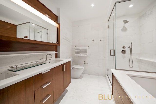 60 Riverside Blvd Unit 2403, New York City, NY 10069 - bathroom featuring vanity, a shower stall, toilet, tile walls, and recessed lighting