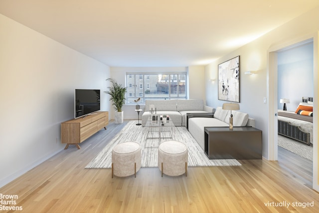 30 E 62nd St Unit 11A, New York City, NY 10065 - living area featuring wood finished floors and baseboards
