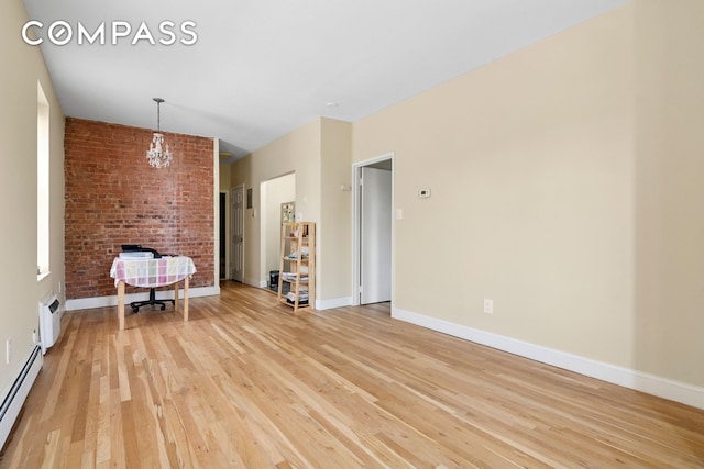680 81st St Unit 3D, New York City, NY 11228 - living room featuring a baseboard heating unit, light wood finished floors, a chandelier, and baseboards
