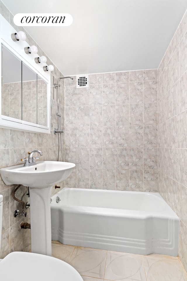 1311 Brightwater Ave Unit 14B, New York City, NY 11235 - full bathroom featuring tile walls and  shower combination