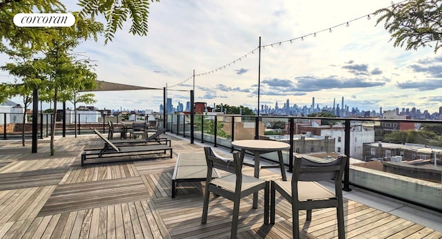 24-75 38th St Unit C9, New York City, NY 11103 - wooden terrace featuring a skyline view
