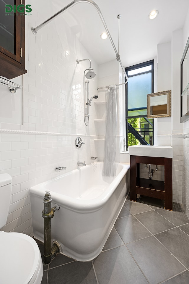 135 W 79th St Unit 1D, New York City, NY 10024 - bathroom with tile walls, shower / bath combo with shower curtain, tile patterned flooring, and recessed lighting