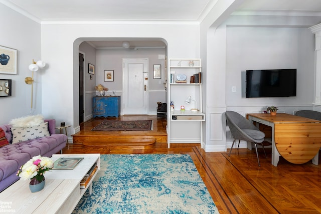 300 W 72nd St Unit 6E, New York City, NY 10023 - living room featuring arched walkways, wood finished floors, and ornamental molding