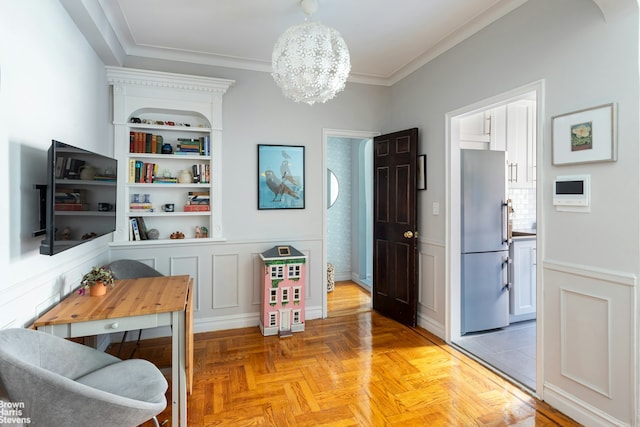 300 W 72nd St Unit 6E, New York City, NY 10023 - dining room featuring a chandelier, ornamental molding, and wainscoting