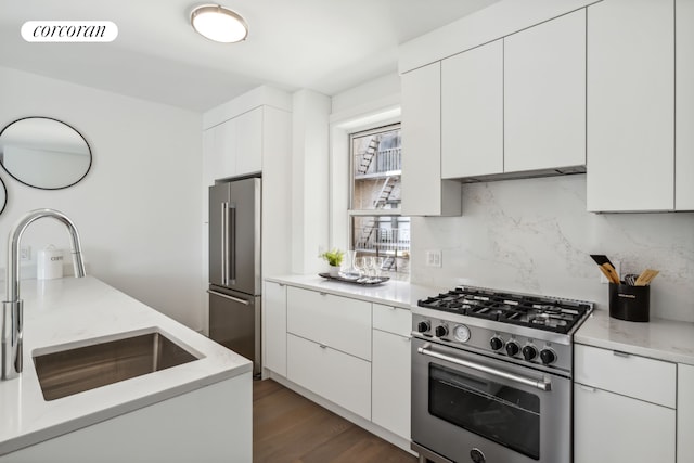 148-09 Northern Blvd Unit 4M, New York City, NY 11354 - kitchen with high quality appliances, backsplash, white cabinets, modern cabinets, and a sink